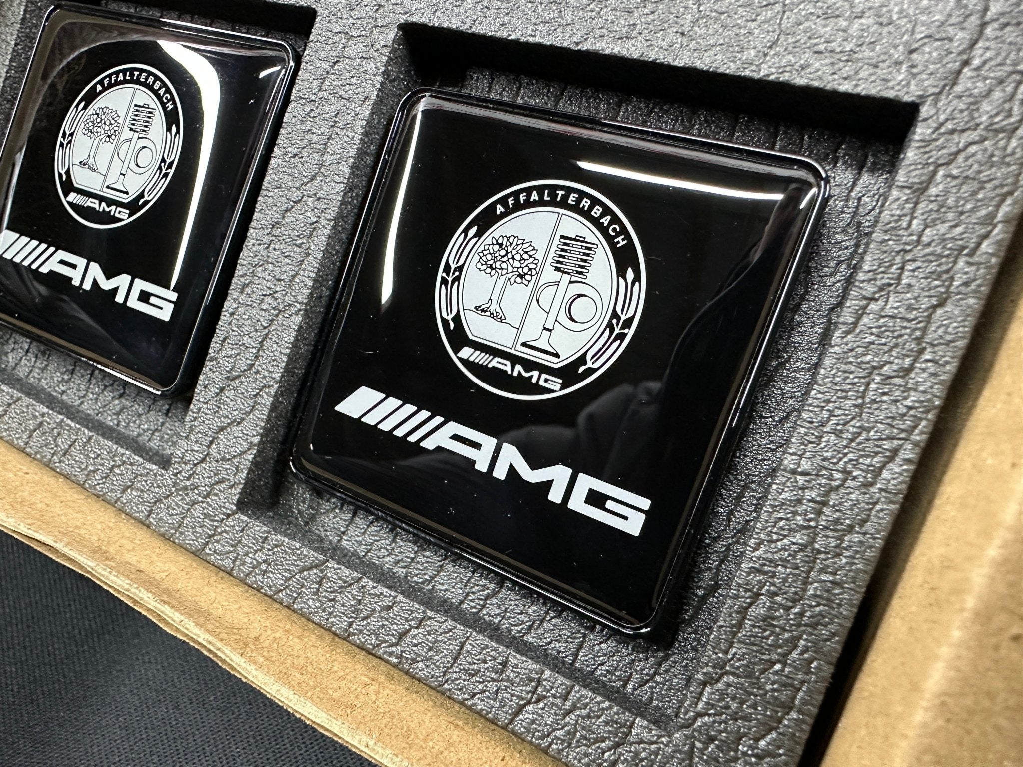 Seats Emblem set in black color with AMG Affalterbach logo for Mercedes-Benz